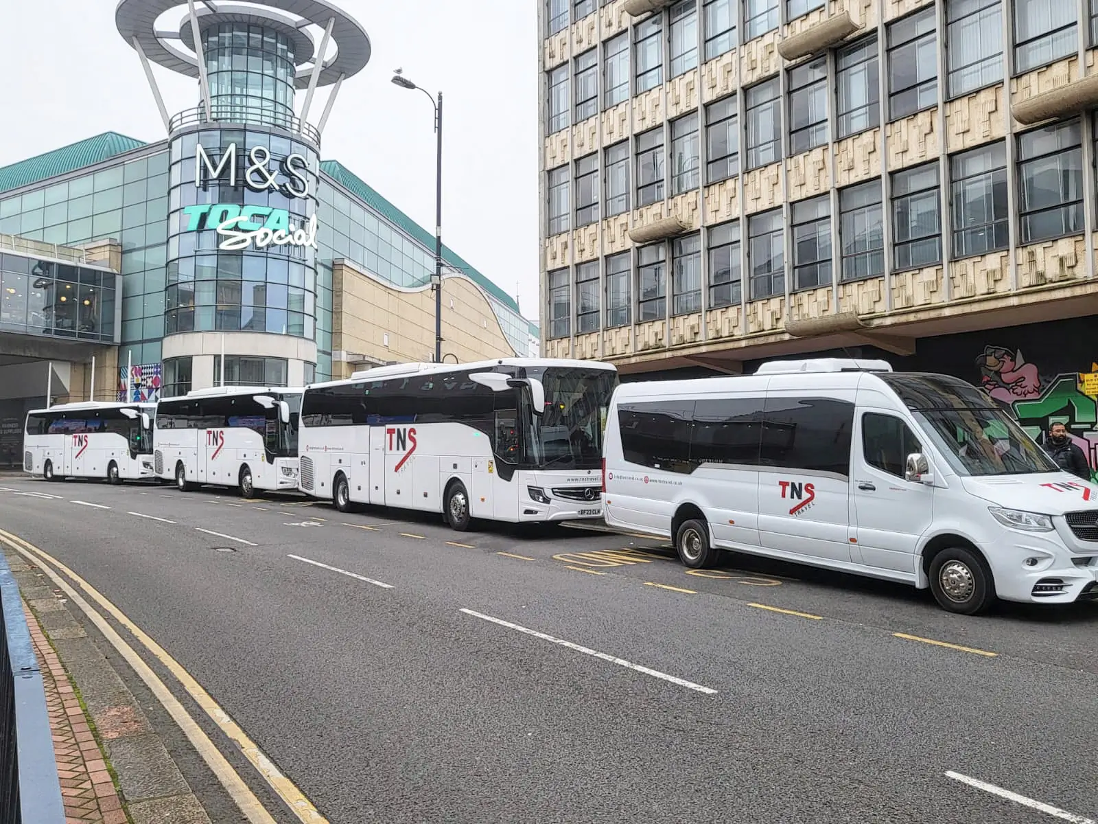 TNS Travel coaches and minibuses lined up