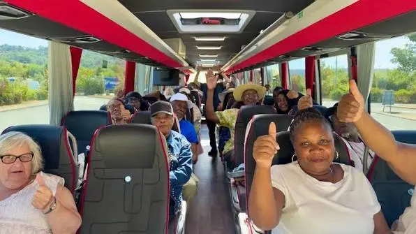 Staff travelling together on a TNS Travel coach
